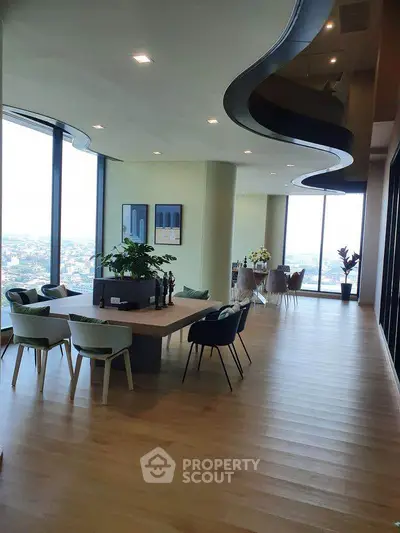 Luxurious modern living room with panoramic city views and elegant decor.