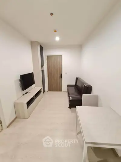 Modern minimalist living room with sleek furniture and neutral tones