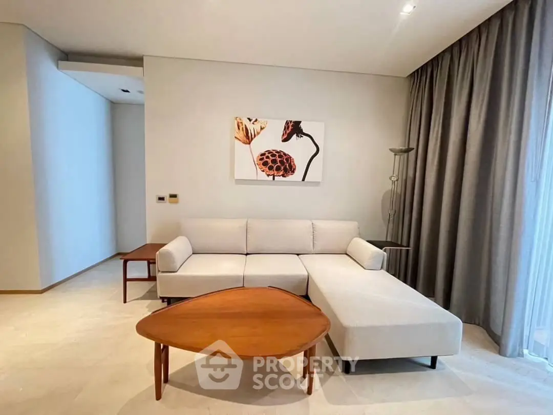 Modern living room with stylish sofa and artistic wall decor