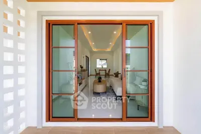 Modern living room with elegant sliding glass doors and stylish interior design