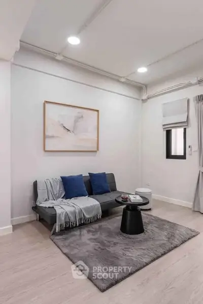 Modern living room with stylish decor and cozy seating area.