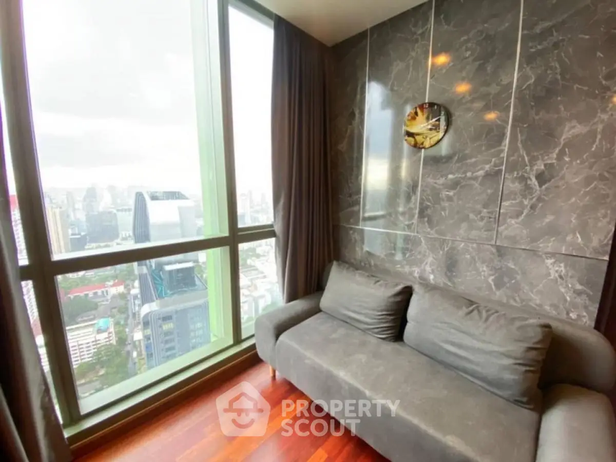Modern high-rise apartment with stunning city view and stylish interior design