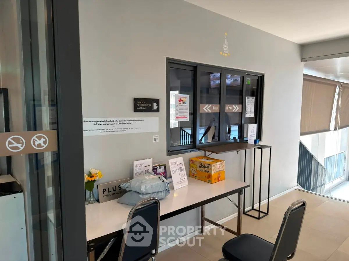Modern building entrance with reception desk and seating area
