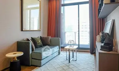 Modern living room with stylish decor and city view balcony access.