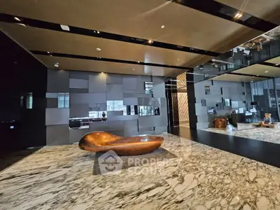 Luxurious modern lobby with marble flooring and unique wooden sculpture centerpiece