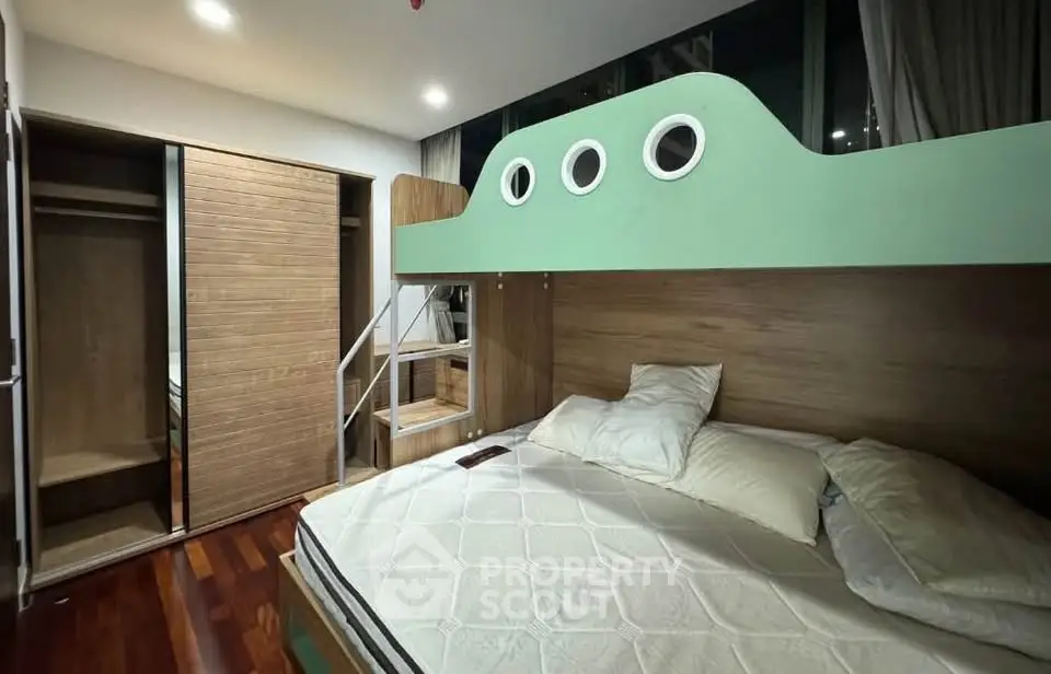 Modern bedroom with unique bunk bed and wooden flooring