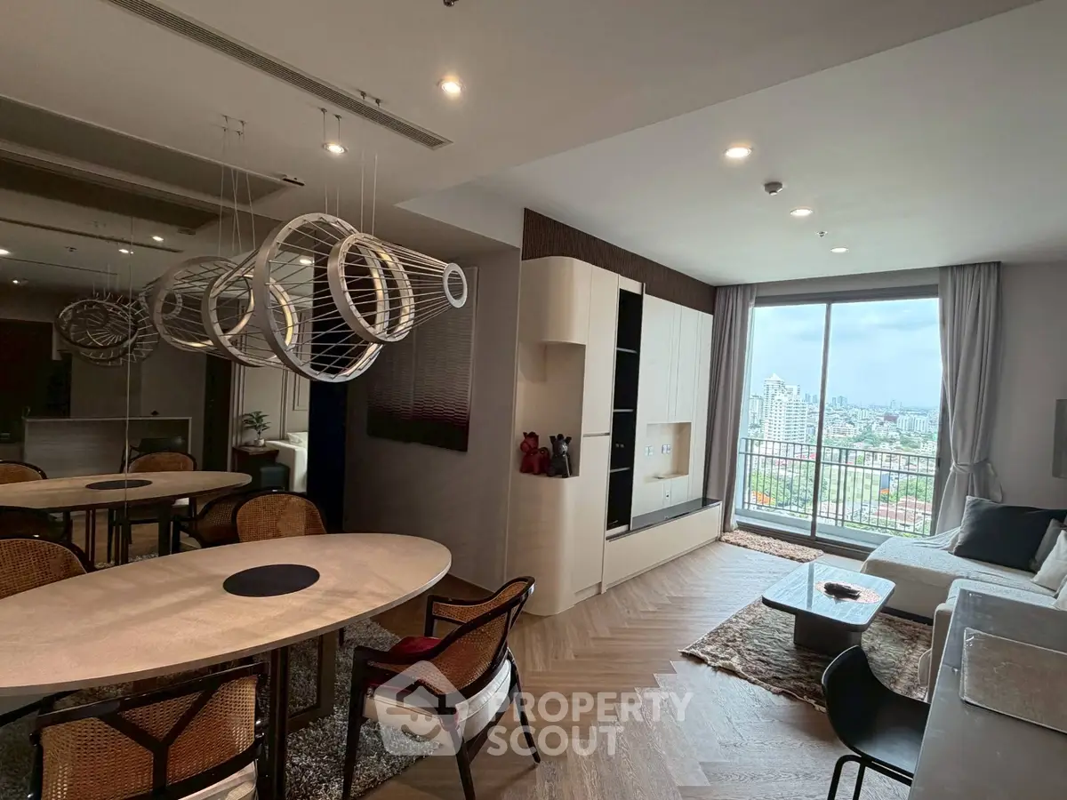 Modern living room with stylish decor and city view from balcony