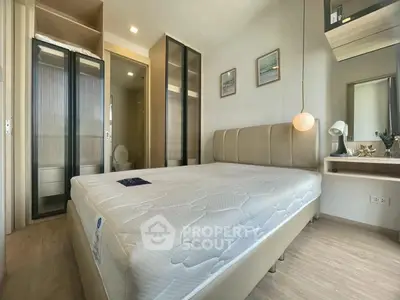 Modern bedroom with stylish decor and ample natural light