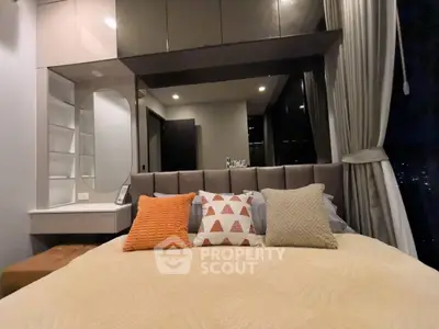 Modern bedroom with stylish decor and city view, featuring cozy bedding and elegant lighting.