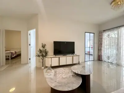 Spacious living room with modern decor and natural light