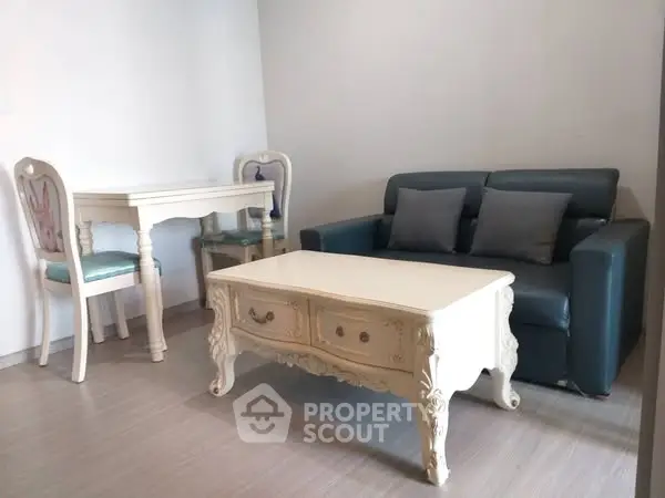 Charming living room with elegant vintage furniture and cozy seating area.