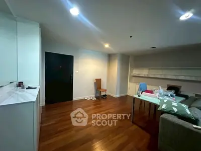 Spacious living room with wooden flooring and modern furniture