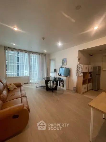 Spacious living room with modern decor and natural light