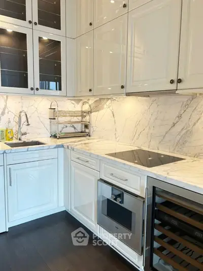 Luxurious modern kitchen with marble countertops and sleek cabinetry