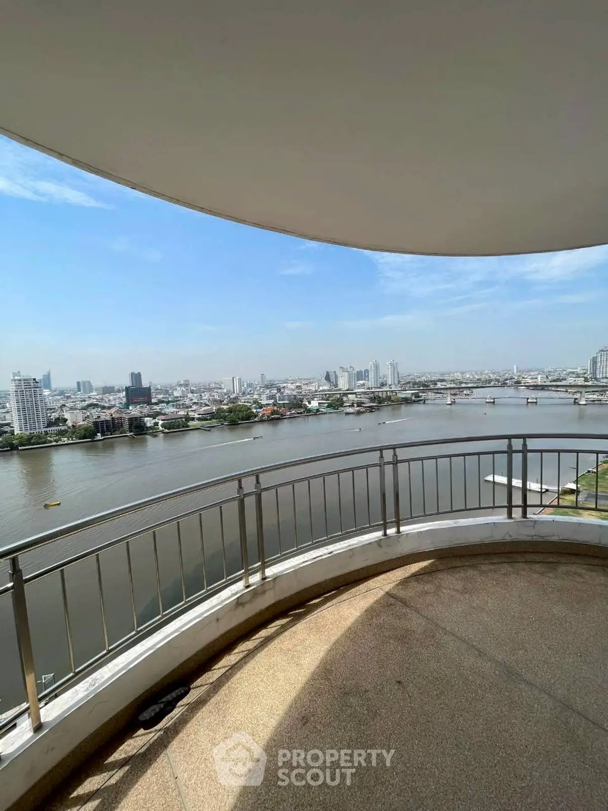 Stunning river view from spacious balcony in high-rise apartment