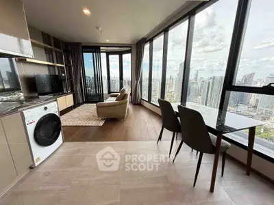 Luxurious high-rise apartment with stunning city view and modern open layout.