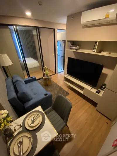 Modern living room with stylish furniture and open layout in a cozy apartment.