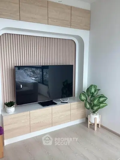 Modern living room with sleek TV setup and stylish decor