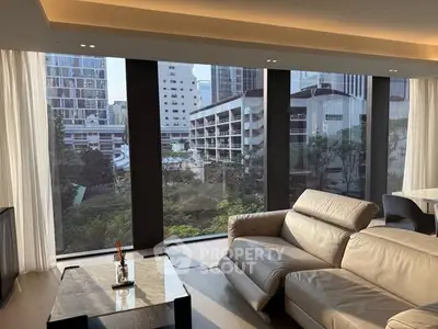 Luxurious living room with panoramic city view and modern leather sofa