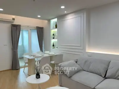 Modern living room with elegant dining area and stylish decor