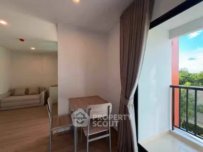Modern apartment with cozy living area and balcony view