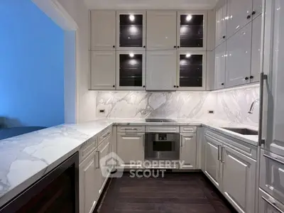 Luxurious modern kitchen with marble countertops and sleek cabinetry