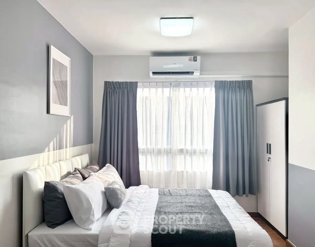 Modern bedroom with stylish decor and natural light