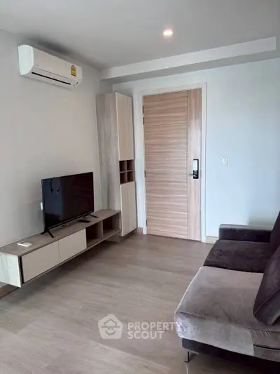 Modern living room with sleek furniture and air conditioning