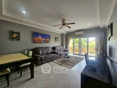 Spacious living room with modern decor and balcony view