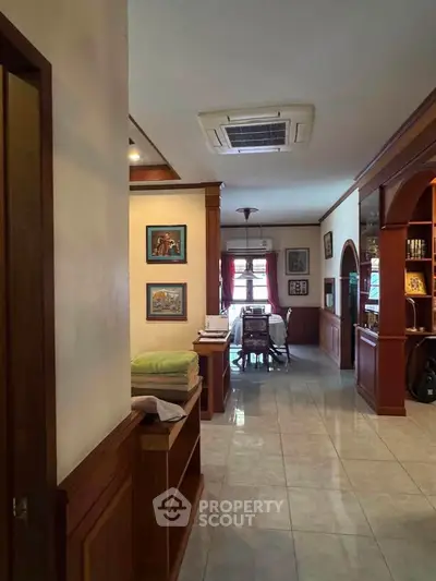 Charming interior with wooden accents and cozy dining area, perfect for family gatherings.