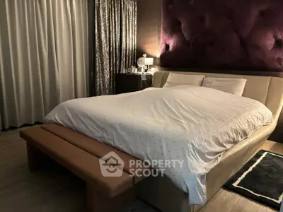 Luxurious bedroom with plush headboard and elegant decor