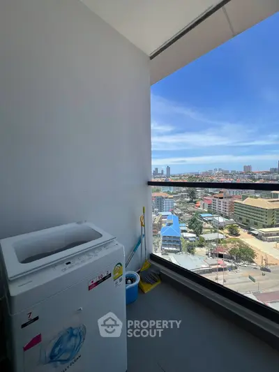 High-rise balcony with washing machine and stunning city view