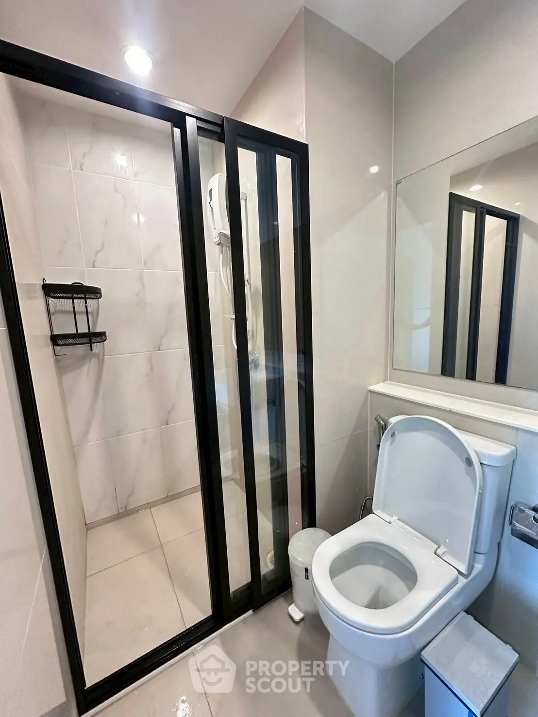 Modern bathroom with sleek shower and toilet design