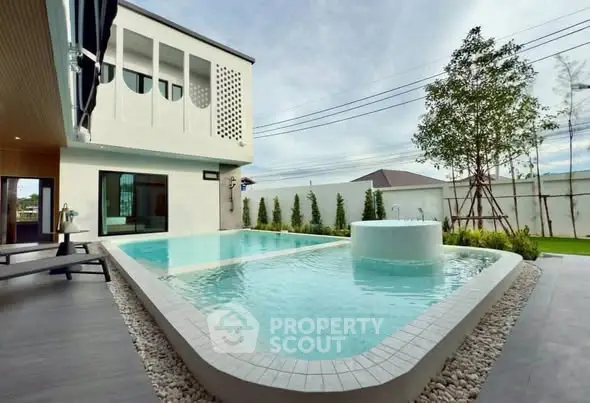 Luxurious modern home with stunning private pool and elegant exterior design.