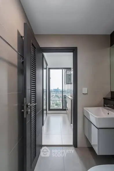 Modern bathroom with sleek design and city view from window