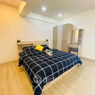 Modern bedroom with stylish decor and cozy ambiance, featuring a comfortable bed and elegant furnishings.