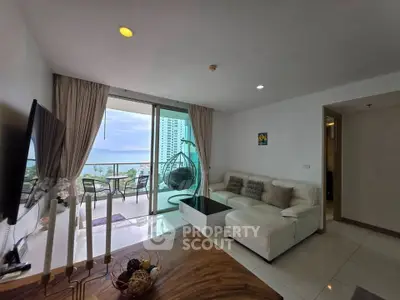 Luxurious living room with stunning balcony view in modern high-rise apartment