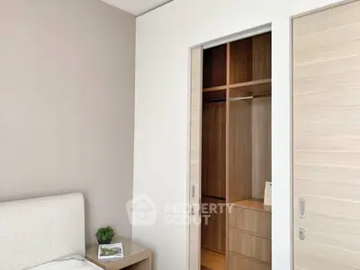 Modern bedroom with built-in wooden closet and minimalist decor