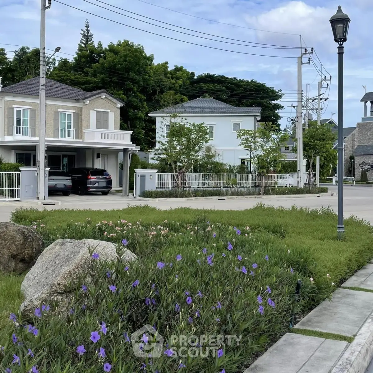 Charming suburban neighborhood with modern houses and lush greenery