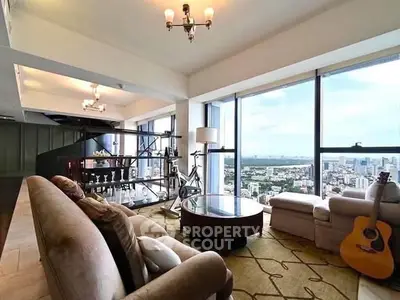 Luxurious living room with panoramic city views and elegant furnishings.
