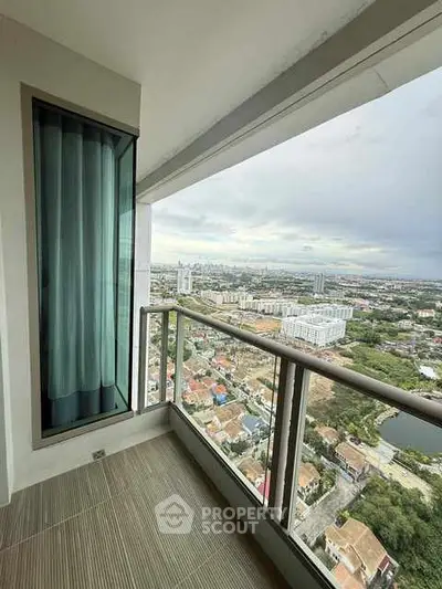 Stunning high-rise balcony with panoramic city view, perfect for urban living.