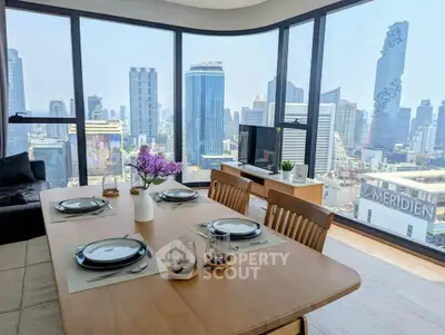 Stunning high-rise dining area with panoramic city views and modern decor.