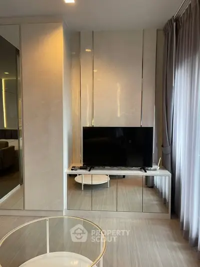 Modern living room with sleek TV unit and elegant decor