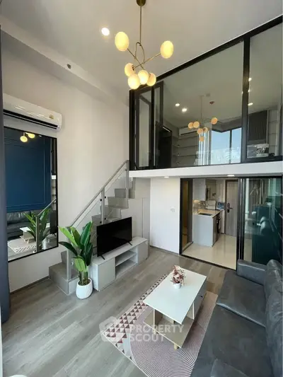 Modern duplex living room with stylish decor and open kitchen layout