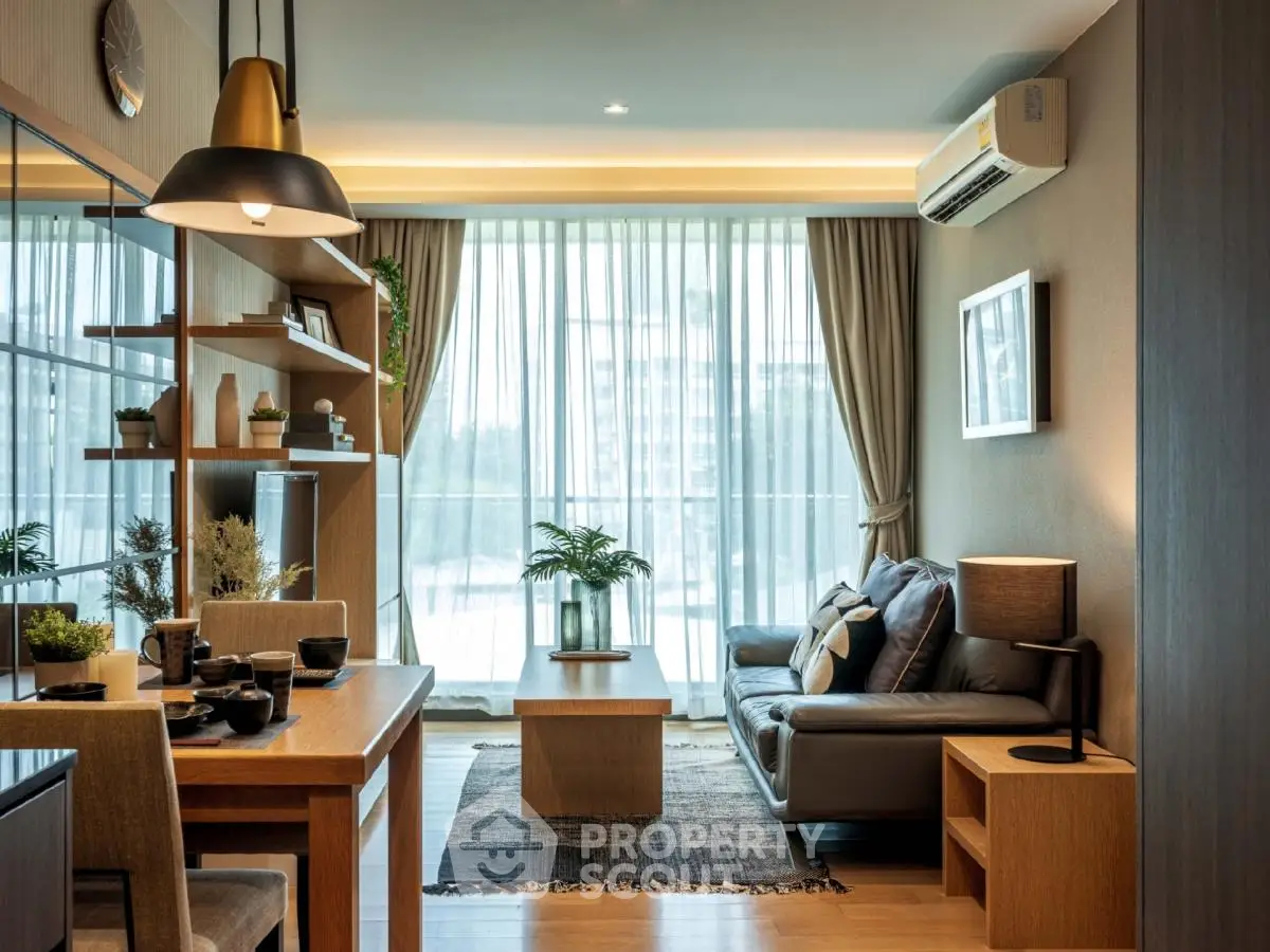 Modern living room with stylish decor and large windows in a cozy apartment