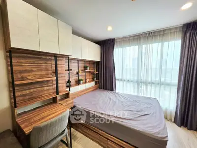 Modern bedroom with wooden furniture and large window with city view