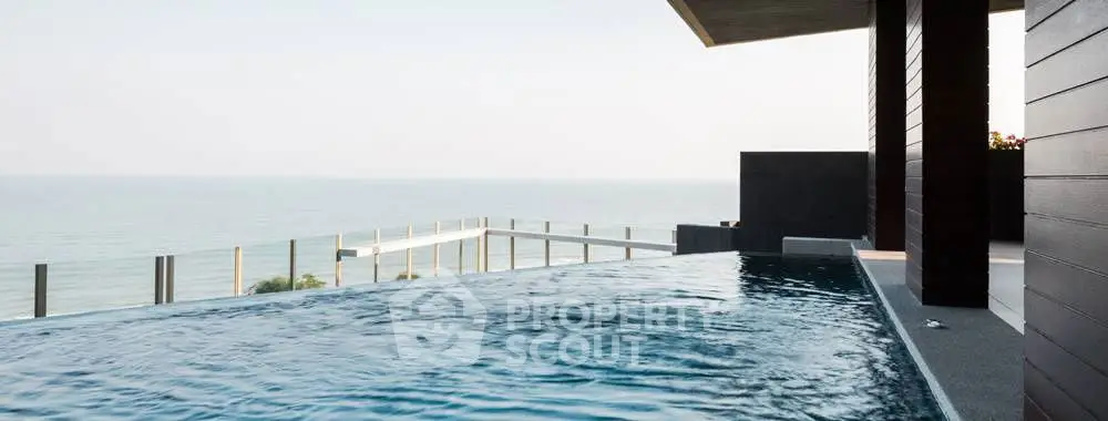 Luxurious infinity pool with breathtaking ocean view, perfect for serene relaxation and upscale living.