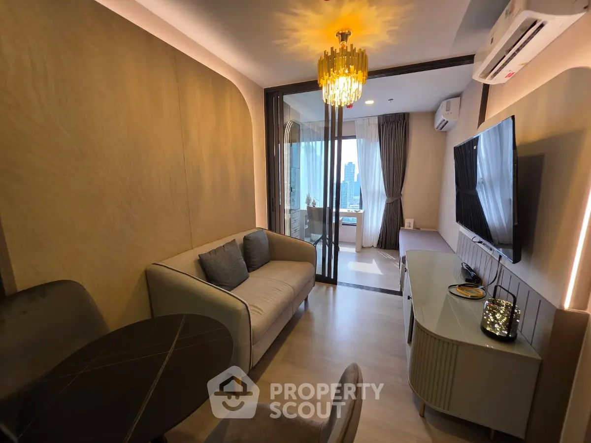 Modern living room with elegant decor and city view balcony