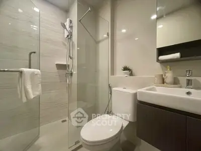 Modern bathroom with glass shower and sleek fixtures