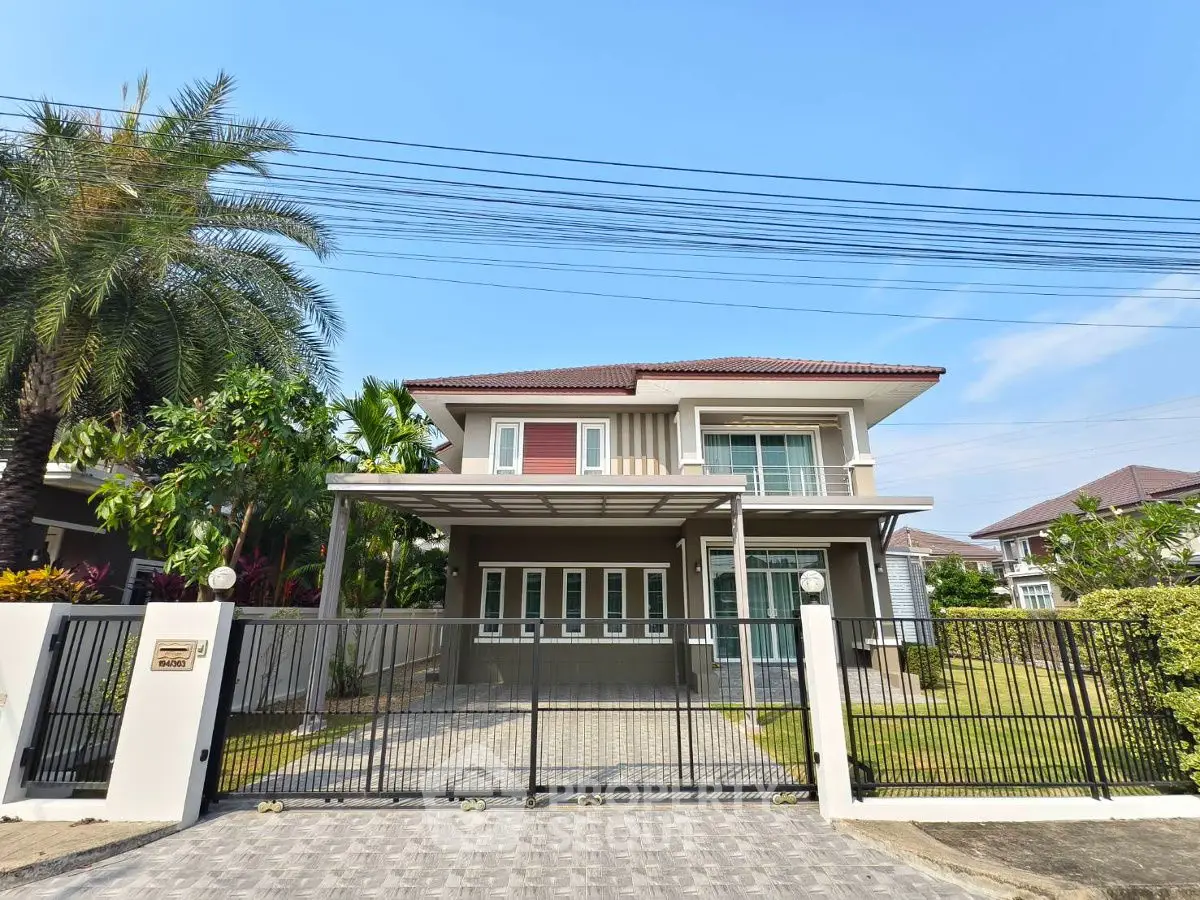 Modern two-story house with spacious driveway and lush garden in a serene neighborhood.